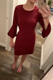 I wear this dress to work and always get compliments on it. It is very flattering and high quality material. I tie it both in the front and the back, but I do wish the the bow went all the way around the dress. - Elena T.