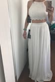 I am a 30E, and a 24/25 waist in pants, with a pretty straight torso below my chest. I selected a small after reading reviews and was surprised at the way this fit. I expected the chest to fit and the skirt to be large - it ended up the other way around. Even with the straps cinched to the neckline and the back laced as tight as possible, the top was still large and fit loosely for me. It looks okay, but really accentuates my bust, and looks loose by the way the top doesn't cling to the upper part of my chest. This just may not be the best fit for someone with a large chest and small rib cage. - Chelsea T.