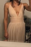 This dress is the perfect combination of dainty and romantic. The color I purchased was cream. It's a beautiful mix of this cream with light blush undertones. Will be wearing this in the bridal party for my friend's wedding in May. The dress is a bit long, but that was expected given that I am petite. I will get the bottom hemmed but that's all the alterations I need with this dress. Maybe I can update the final look but as of now here are my photos! - Shaina A.