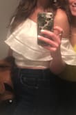 I wore this top for my bachelorette party that was fiesta themed. It fit perfectly and it didn't move around at all! I did not spend the night re-adjusting anything which I think is great! - Samantha R.