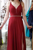 I purchased this dress for prom, and I ABSOLUTELY LOVE IT! I ordered a size larger than what I typically wear, but the straps in the back make it extremely adjustable. The straps are a little difficult to thread through the holes (have a pin ready), but do not budge after being laced up. I am going to need to alter the waist band smaller (but that is just because I have a small waist). With three inch heels, the dress is a little too long (I am wearing heels in the picture). The material is just as described and NOT "cheap-looking." The color is perfect, meaning not red but maroon/wine red. The slit is not too high and the neck is not too low. 100% recommend! - Izabella A.