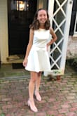 I got this dress for my homecoming and it was absolutely stunning. I received many compliments, and I felt very pretty. I was looking for a modest fit and flare dress and this one was perfect. It is an open back, so you will have to find a bra to accommodate that, but there are many options available. I think my favorite part of the dress was the lace detailing in the back. It's a good length too. - Megan S.