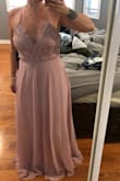 This dress is very pretty. I am usually a true med, but this dress is big on me. I think a small would be too small though. The dress is super long, so will need some altering anyways. The length is nice because I would rather it too long than too short. All in all a beautiful purchase. It's more pink than purple and I just LOVE it for my upcoming part as a bridesmaid. - Erin F.