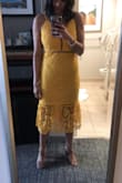 Wore this dress to a wedding in Florida and it was perfect. Fit snugly but was flattering and the bottom is even more beautiful in person. - Sabrina J.