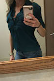 Beautiful green color.  Great fit and comfortable for the office.  Great to tuck in or leave un-tucked.  I purchased 2 in different color because I love so much.  Material is not sheer at all so no need to wear an under shirt.  I am wearing a lace bralette to cover my cleavage for the office so I don't have to button it all the way up. - Mandi Y.