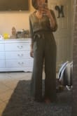 I was scared since the jumpsuit was final sale, however it fit perfect. I'm wearing it with 3inch block heel sandals and it's a good length, no dragging. I am so glad I bought both the olive and black ones. If you are doubting to purchase... just buy it before it sells out! - Maria B.