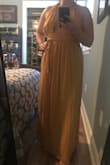 Very cute dress but the top is not a tie, it's elastic. I'd say easy tailor if you'd want to do that but it makes the top very large. I'll have to return. - Mackenzie W.