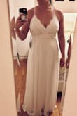 I was between a medium and large, I ended up ordering both and the Medium fit perfectly! It was a tad long, but other than that, no alterations needed. This was one of my choices for a wedding dress to elope in. I loved that it was light and easy to move in, but ended up going with another dress in the end. It is beautiful though and highly recommend! - Ashley M.