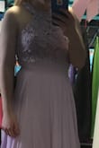 Dress is very pretty. My daughter loved the dress. It fits perfect at the top. We will need to hem the bottom, but that is no big deal. Very well made. - Caitlyn W.