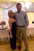 I wore this to a wedding and got so many compliments. It fit so well and I had no issues with it being strapless. I did have to get it hemmed since I'm only 5'2". Love it, highly recommend! - Alyssa O.