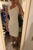 Personally not crazy about this dress. Looks better in the picture and was tough for me to zip up even thought I wear XS in the rest of my lulus clothes. Looks like a costume to me. I will say, though, that the fabric is nice and thick and you can't see through it which is impressive for white! - Nicole M.