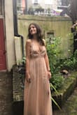 I bought this dress last minute for an event in New Orleans. I loved it the minute I tried it on! It fit like a glove and the sequins detailing was beautiful! I wore 4 inch heels with this dress and the hem did not touch the ground. - Christine G.