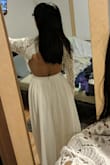 I originally bought this dress in size small, but noticed the sleeves were very loose, especially the arm hole area. The sleeves were also too long. The waist fit well and the dress was long, but that was expected for my height.

I was hoping switching to XS would help the sleeve situation but it did not. The only think on the dress that got smaller was the waist. The XS waist is a little bit tight, while the sleeves are still long and loose. I'm hoping I'll be able to find someone to fix sleeves for me, but I'm guessing it will be a challenge since it is crocheted. - Amanda N.
