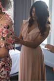 This dress is very true to the model photos. It was the slightest bit loose on top but was not a huge deal. The material was nice, I used an adhesive bra, would not have been able to do no bra. It was beautiful in a very simple elegant way. My heels were only a couple inches tall and I had to lift the dress to walk, so you need high heels or hemming if you're shorter/ average height. Overall I'm very happy I got this dress for my sister's wedding. - Stuti S.