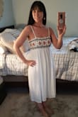 This dress is perfect! I got the small because I'm small on top where the dress is fitted, and I'm so glad I did because I was going to get the medium as I carry weight on my lower half! The small is great fit, the bottom is very forgiving so order for your bust..! It's a tad shear even with underslip so you have to wear nude color underwear.. The beading has silver beading in it and is beautiful and so summery!! It's a perfect length for sandals or heels and it's not too short like so many pretty dresses. - Gina A.
