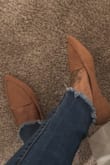 The material is nice. After walking around all day I may need to purchase a cushion for the insole, but other than that it's beautiful. Looks exactly like pictures. - Clairiess W.