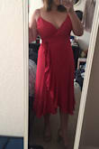 First of all, I ordered this dress is the berry color and the color is so rich and flattering. I would say the dress is worth it for the color alone. Very nice quality for the modest price, as well. I purchased this in an XL based off my previous Lulus purchases. The fit is quite nice, but it's a little loose under the armpits. I will have to have this part taken in, but that's not a big deal. I would rather have a little extra fabric than too little.This is a TRUE wrap dress, and thanks heavens it is! It is extreme flattering, a modest length which balances out the cleavage, and it's great with an hourglass figure. Highly recommend! For reference, I wear a number size 14 at other stores, and the XL fit perfect. - Ana P.
