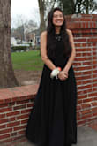 The material was comfortable and breathable! I wore this dress to prom and had a great time with no concerns about sweating the night away. It's obviously a very open dress and the strappiness of the back allowed for something extra to the dress. The size was great, adjustable all over but its an extremely long dress as well. Nothing a little carrying couldn't fix whenever I walked. Overall I absolutely loved it and got many compliments throughout the night. - Olivia F.