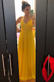 I originally purchased this a) because I love the true sunshine yellow and have been looking for a yellow formal dress for a while & b) as a potential for my bridesmaids' dresses. I ordered both the XS & S, the XS was a little too tight around the band. Ultimately I'm keeping the S and will be using it for engagement pics. The color is really a true beautiful yellow, not mustard, green-toned, dull, or neon. The cut looks fantastic on, substantial but not to heavy. - Noel C.