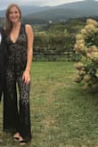 I'm obsessed with jumpsuits and got this for a fall wedding. I'm a little tall for a small, but this still fits really well. The length is perfect with heels. It looks expensive. The front cut is low, but not over revealing. - Ginevra C.