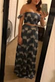 I absolutely love this two piece set. There's a slit on each side of the skirt, but it's not too much. You can wear the top with or without a bra. The top is very stretchy, so it doesn't feel too tight or too loose. It feels just right. The skirt has a little bit of elastic in the back which helps it have the perfect fit. Can't wait to wear on my honeymoon! - Kaelin W.