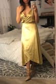 Absolutely beautiful! The wrap is very secure, and I love how there are adjustable straps. The fact that it's a wrap dress makes it very adjustable to size. Really pretty color too! Great dress for the price. - Shannan G.