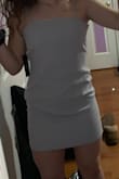 It definitely is very cute but looks boxy and fits larger in the stomach and waist. There are a lot of wrinkles. Tighter in the bust and kind of big in the lower back area, but it makes your butt look good. The back design is sooo pretty though. Decent material. - Jaclyn C.