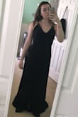 I absolutely fell in love with this dress the minute I saw it. if I could have I would have ordered a small but it stills fits great. The straps are adjustable which is a total life saver! (also the length is quite long but the material is easily hemmed!) I love love love this dress and can't wait to wear for my senior prom! It's classy and sexy all put into one dress. - Morgan E.