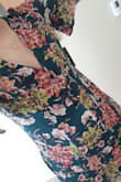 This dress is very cute. The material is soft. The length is good. I really like how it is a little longer in the back and when I raise my arms, it is still not too short.
However, it does run large. I usually wear a medium, but the size medium in this dress was noticeably too big. The waist was loose which is fine with me, but the cleavage cut was way too low and loose. It was also baggy under the arms which made me look like a child in an adults dress. I am returning. - Autumn F.