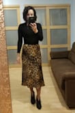 I absolutely love the skirt. I purchased my regular size S and it fits great. I love the feel of the fabric, the way it flows, and the overall fit. The skirt hits couple inches below my knees, as I am 5'4", but I love the midi length. I looks amazing with a black or white top, can dress it up or down. - Anna N.