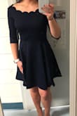 This dress was very comfortable and flattering! I originally had tried it on without heels and it was great, but with high heels it appears a little shorter, as expected though. The material is great, very soft and a little thick which is great for winter outings! - Aspen
