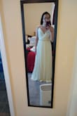 After looking at a variety of bridal boutiques, I turned to Lulus. I purchased this dress and two others to try on, and this will be the one I wear for my September wedding! It is very simple, flowy, and everything I was looking for in a dress.The color is a beautiful ivory! It comes with adjustable straps which will limit the amount of alterations needed for the dress. I will only have them hem the bottom about 2 inches and then take in the bodice ever so slightly for a more fitted look. I will be pairing this with a simple pearl and jeweled sash to dress it up. Thank you Lulus for saving the day with this inexpensive but perfect option! - Sara Z.