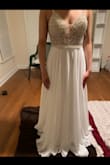 This dress is perfect! I was nervous ordering my wedding dress online but I'm glad I did! Great quality, you would think I spent thousands. The bottom half is very flowy and it's not see through which is great, it's lined. I don't think I'm getting any taken off the bottom, I like the length. If you're looking for a beautiful wedding dress on a budget this is perfect! - Shameria O.