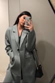 Although this coat is intended to run larger, it looks like I borrowed my father's coat to run an errand. When styled correctly, I feel that the fit is appropriate, but if you plan to wear it for daily wear: get a smaller size. - Brennan B.