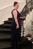 The dress fitted perfectly. I wore it to my friends wedding. I loved, loved the ruffles on the dress. I also loved the color. I felt so elegant in the dress. - Brenda S.