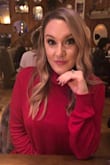I love the fit of this turtleneck. You can wear it long with leggings or tuck the front into your jeans for a more casual look. I didn't fold the turtleneck and just wore it high. - Nicole A.