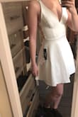 Very flattering but needs to be ironed lol. I am super picky about fabric and this is sturdy, nice fabric and lined. Love the back. - Alicia B.
