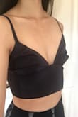 Soft comfortable material and hugs my body really well! I ordered an XS and the only issue I have with it is there's extra fabric at the center padding that my chest won't fill out, and it makes my chest look super weird. I won't be wearing it alone. It's perfect for wearing underneath sheer tops! - Kristine L.