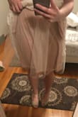 This dress fits great - I normally wear an XS & that's what I ordered. The cut in the front is lower than expected, but the lace detailed edge of the straps conceals most of the clevage. I will agree with others that say the layer of tule under the lace is too poofy so I'll be removing that. The pockets are sweet, lace is thick & nice quality. Plan to wear this for a laid back wedding reception. - Bobbi B.