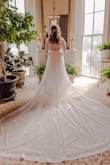 I really did love the sleeves and back of this dress. I added cups to the bust and took it in a bit to make the bust look fuller. I also got an attachable train to make it longer. Being so inexpensive it's an easy dress to customize. - Claire C.