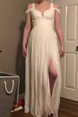 This dress is very pretty. The top is very flattering. I'm a smaller chested gal and I like that you can wear this without a bra and still get a little bit of cleavage! However, I don't really love how sheer the bottom is, especially with how flimsy the lining is & the high slit. Also, not quite long enough for me at 5'9. - Elissa S.