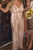 This jumpsuit is so cute, and better than I expected. Super flattering and more sparkler than I thought it was going to be (which is always a good thing). I ordered the XL, and I maybe could have gone down to a L! But I'm still very happy with the XL. - Saffron S.