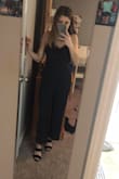 I love this jumpsuit. I know its supposed to be a cropped leg but I am 5'1" so I wore it as a full leg and it was fine! I was nervous to hem this material so if you're stuck on the crop look and you're short like me, it might be tough. I am a XS in most things at Lulus but I got a small in this since the material has no stretch. Jumpsuit is really cute though. Adjustable straps and pockets are a bonus! - Jordan B.