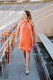 This dress is so cute! It looked just like the pictures online. It fits true to size and looked awesome in pictures. The only complaint I have is the material wrinkles very quickly and it's hard to get out. I sat down for pictures for about 10 minutes and serious creases started to form. I think it's just the type of material it is though. Otherwise, no problems and it's so cute! - Brianne D.