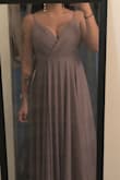 The dress fits perfectly and is flattering. - Melanie A.