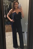 The material is very nice and has good stretch to it without being restrictive. I had to have the legs taken up 3 inches but that is no big deal. This is such an awesome jump suit. Perfect for date night or any special evening or event. I was even able to wear a regular strapless bra with it, which was such a nice surprise. I ordered it in black first and then in blue. Now I feel like I need it in all of the colors. - Cara R.