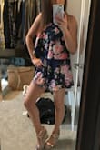 This romper is so fun and flirty. It is very soft and comfortable to wear all day. I love the fabric and the floral design. It is on the shorter side but I don't mind that at all with me being on the shorter side myself. It hits me at the perfect length and the shorts are flowy enough that I don't think the length would ever be an issue. Love it! - Cara R.