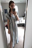 I bought this cover up for my upcoming vacation to Jamaica. I love the fit, and it's light enough that I won't be sweating like crazy. It rolls up pretty small, too, so it's good for packing. I'm 5'4" and it's definitely more like a maxi dress on me than it is on the model, but that's fine. I'd rather wear something that actually covers me up because I burn so easily. - Christine A.