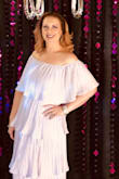 The dress lays beautifully. It's a very flattering style. I received many compliments. It's not terribly heavy. I didn't have to adjust it at all and I danced for hours at my party. It was longer than I anticipated, but I didn't mind. Great buy! - Natalie E.