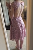 This is a really fun dress! I love that it has an open back, and I didn't need to wear a bra with it so that's really convenient. The color is really gorgeous too. The back clip on the bottom is difficult to latch on your own, so have a partner to help when you're getting ready. The sides are a little funky though and you have to pull the dress down to straighten it due to the backless design, but overall, the dress is so cute! I cannot wait to wear it! - Kassie B.